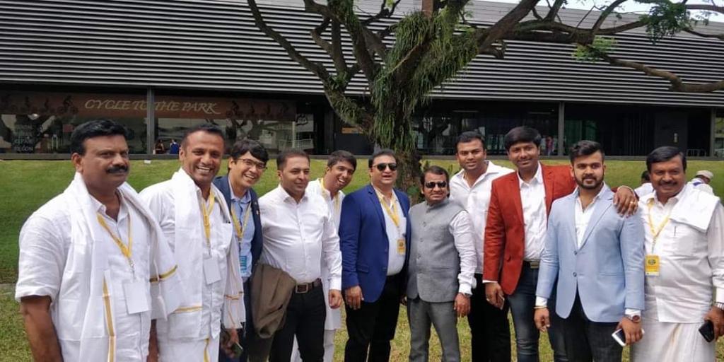 With colleagues and community leaders at an outdoor gathering