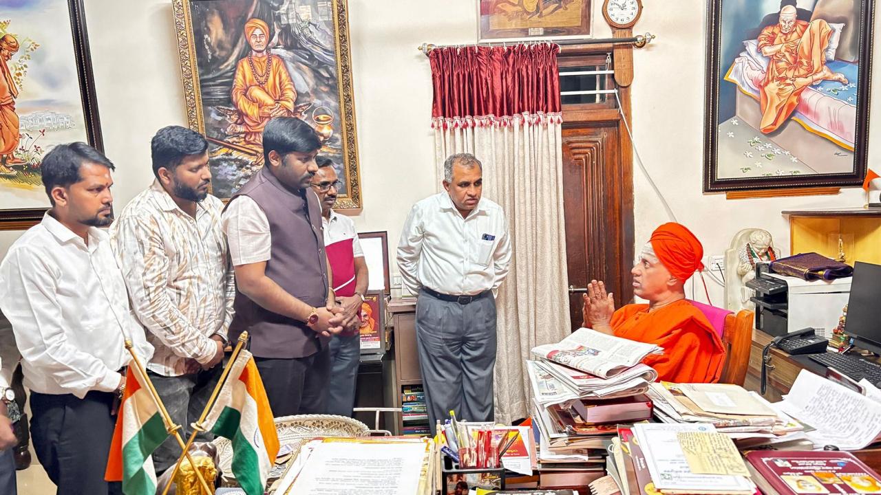 Seeking blessings from the Swamiji with colleagues