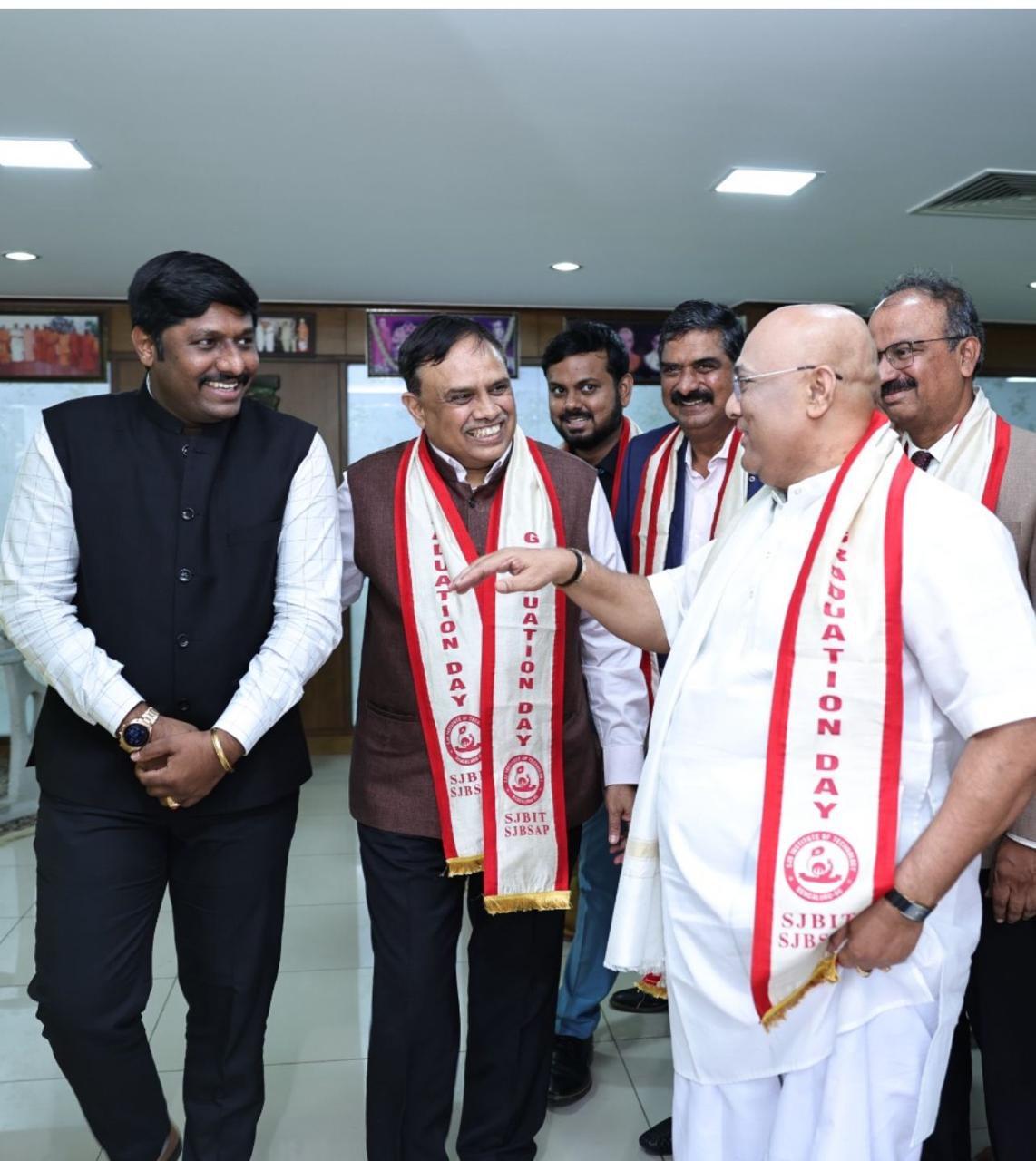 Sharing a light moment with dignitaries at a graduation day ceremony