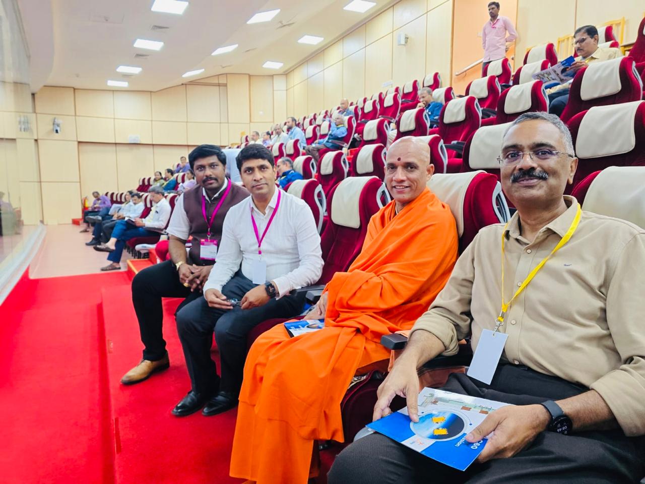 Attending a conference session in an auditorium